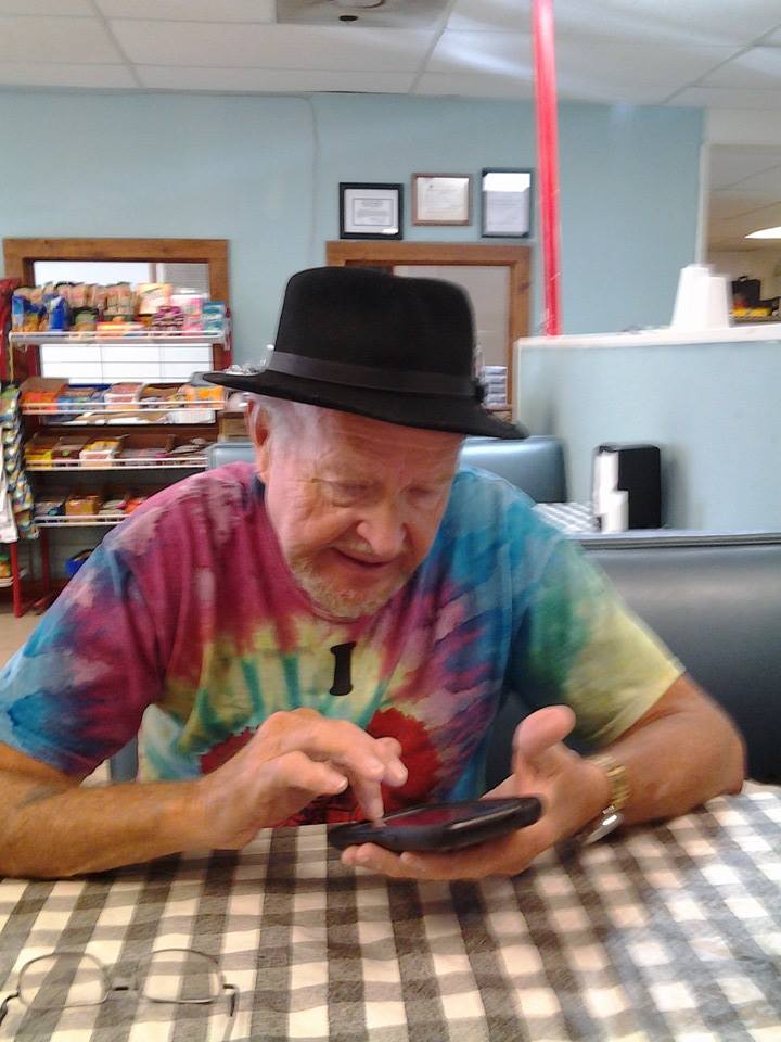 Sherm and I are sitting in a booth waiting for lunch. He is in Misso