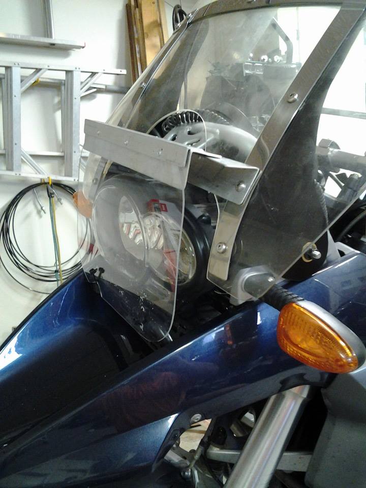 Barney and friend are now in place. I also made a guard for a my headlight lens. Took her out for a a short ride in the neighborhood. seems good to 80.
