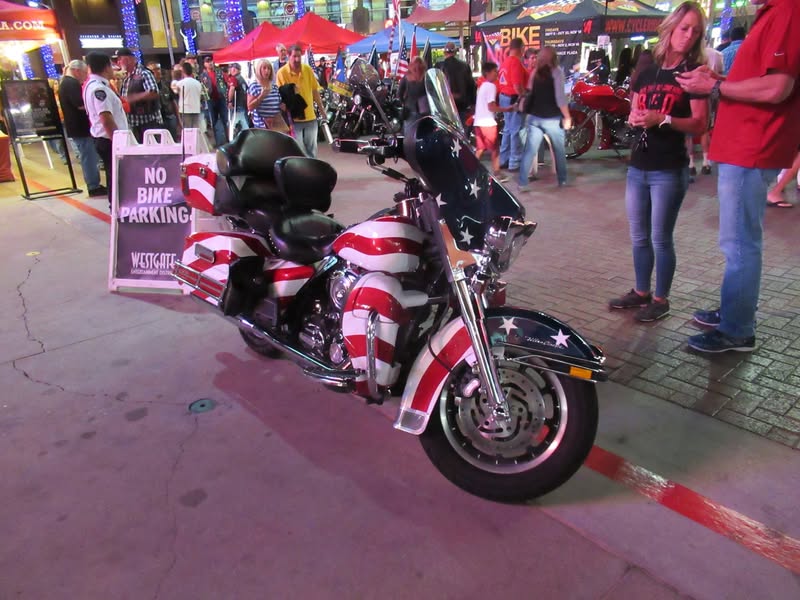 I went to our bike night this evening as it's theme was to honor Veterans. A lot of patriotic bikes, veteran license plates, and even the last surviving vet from Pearl Harbor. A few medals on display as well.