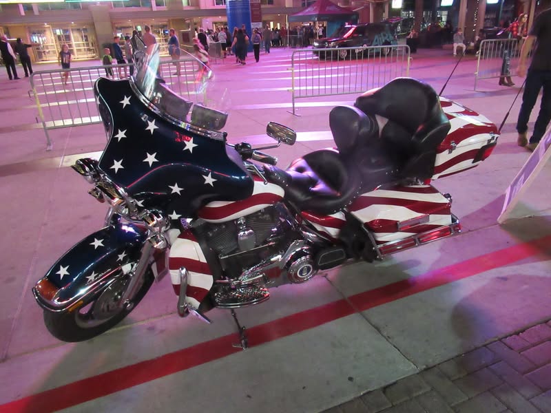 I went to our bike night this evening as it's theme was to honor Veterans. A lot of patriotic bikes, veteran license plates, and even the last surviving vet from Pearl Harbor. A few medals on display as well.