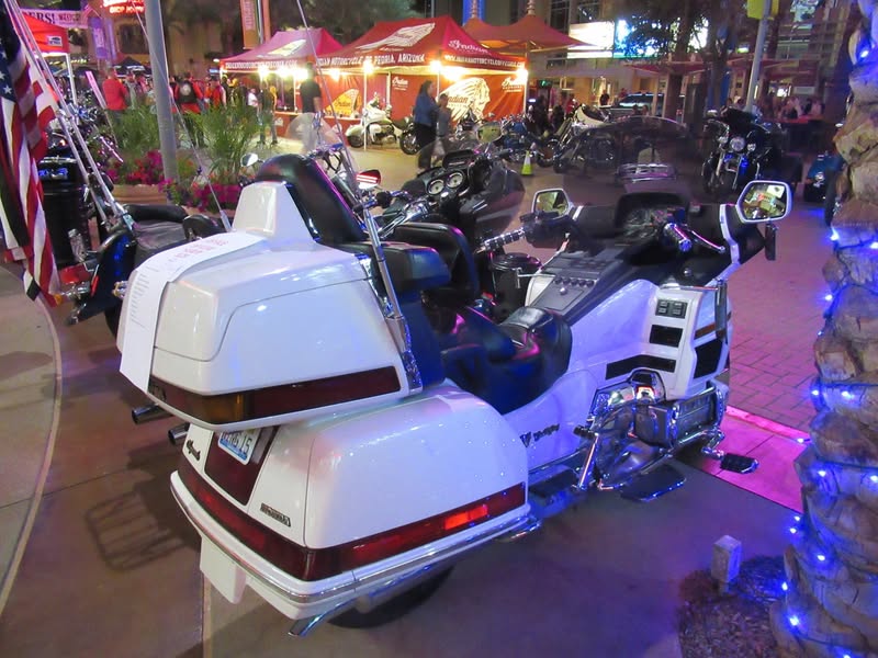 I went to our bike night this evening as it's theme was to honor Veterans. A lot of patriotic bikes, veteran license plates, and even the last surviving vet from Pearl Harbor. A few medals on display as well.