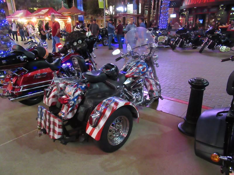 I went to our bike night this evening as it's theme was to honor Veterans. A lot of patriotic bikes, veteran license plates, and even the last surviving vet from Pearl Harbor. A few medals on display as well.