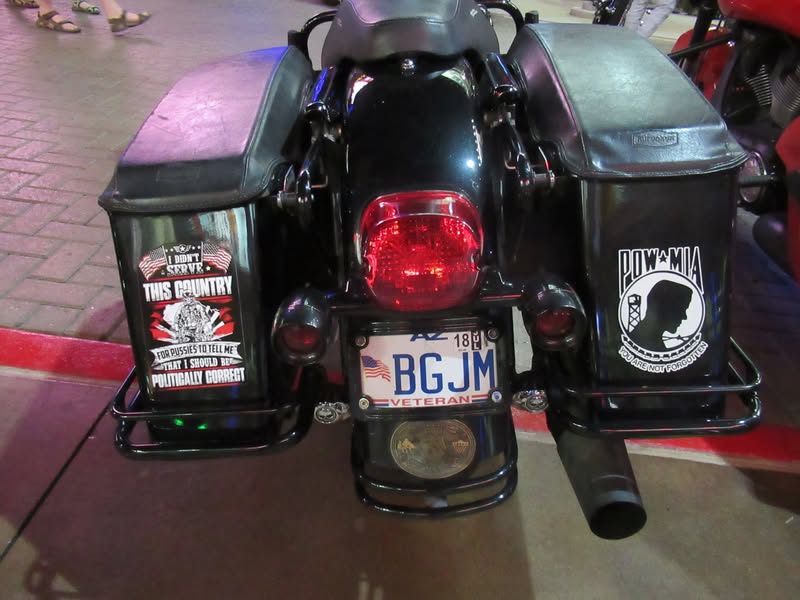 I went to our bike night this evening as it's theme was to honor Veterans. A lot of patriotic bikes, veteran license plates, and even the last surviving vet from Pearl Harbor. A few medals on display as well.