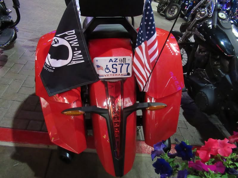 I went to our bike night this evening as it's theme was to honor Veterans. A lot of patriotic bikes, veteran license plates, and even the last surviving vet from Pearl Harbor. A few medals on display as well.