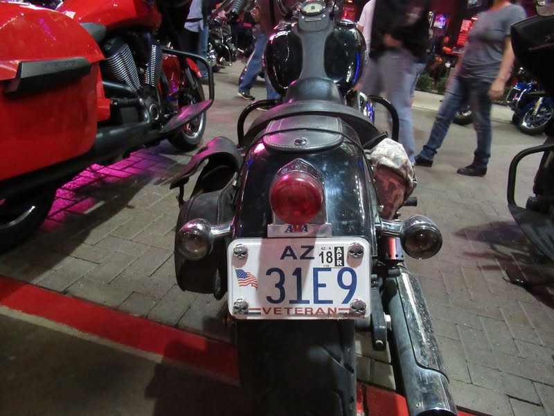 I went to our bike night this evening as it's theme was to honor Veterans. A lot of patriotic bikes, veteran license plates, and even the last surviving vet from Pearl Harbor. A few medals on display as well.