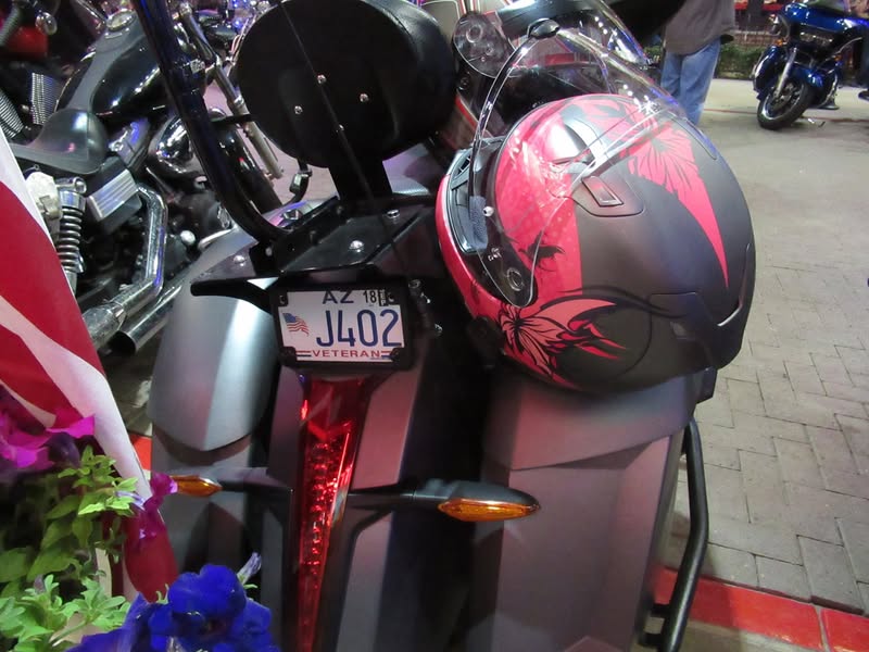 I went to our bike night this evening as it's theme was to honor Veterans. A lot of patriotic bikes, veteran license plates, and even the last surviving vet from Pearl Harbor. A few medals on display as well.