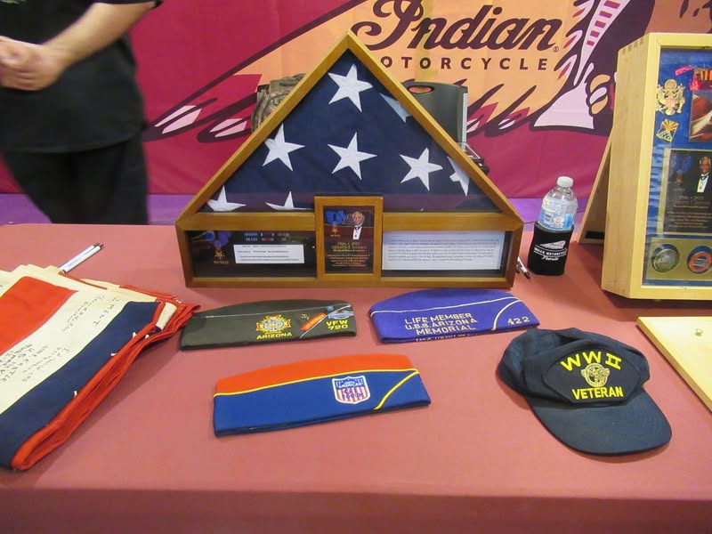 I went to our bike night this evening as it's theme was to honor Veterans. A lot of patriotic bikes, veteran license plates, and even the last surviving vet from Pearl Harbor. A few medals on display as well.
