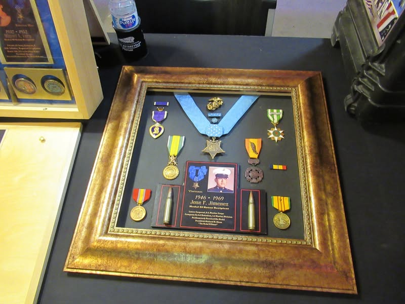 I went to our bike night this evening as it's theme was to honor Veterans. A lot of patriotic bikes, veteran license plates, and even the last surviving vet from Pearl Harbor. A few medals on display as well.