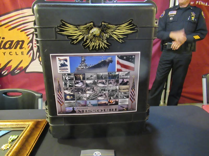 I went to our bike night this evening as it's theme was to honor Veterans. A lot of patriotic bikes, veteran license plates, and even the last surviving vet from Pearl Harbor. A few medals on display as well.