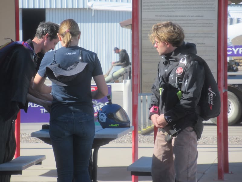 I think the girl is an instructor and she was giving last minute details to these guys.