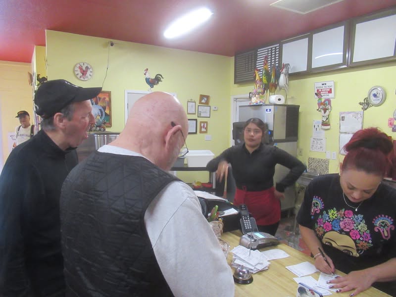 Our waitress bin the background, the accountant at the counter.