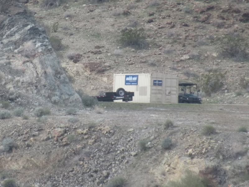 This must be a temporary storage building for tools and supplies for the work they are doing in the 