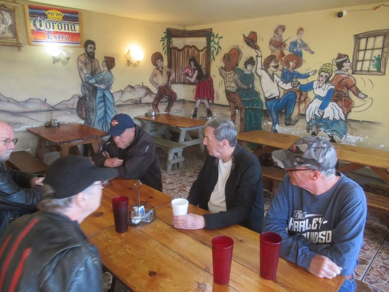Six guys wondering what the food will be like.