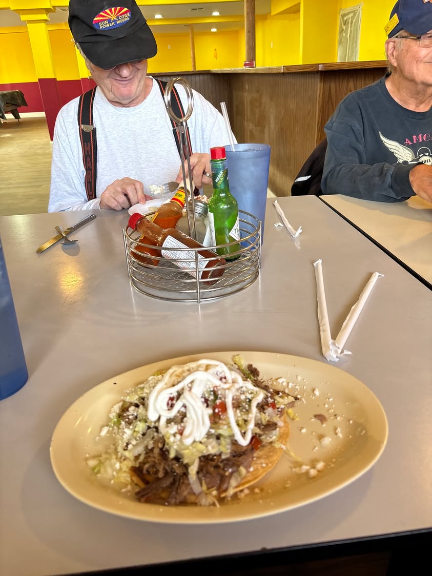 John devouring his chicken tostada.